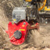 Quadco 32QDM grinding a tree in the forest