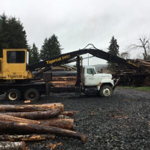 Tigercat 240B attached to an International semi truck